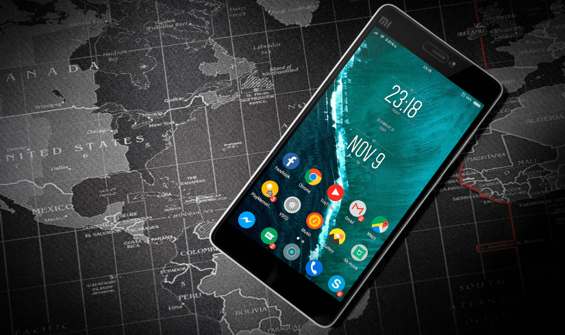 Android based cellphone image floating over world map background....
